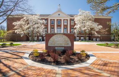 Founders Hall in the spring with Dogwood blossoms